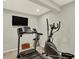 Exercise room with treadmill, elliptical, and TV at 16367 E Auburn Hills Dr, Parker, CO 80134
