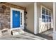 Charming entryway with a blue front door, stone accents, and a welcoming atmosphere at 16367 E Auburn Hills Dr, Parker, CO 80134