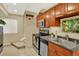Basement kitchen featuring stainless steel appliances and warm wood cabinetry at 16367 E Auburn Hills Dr, Parker, CO 80134
