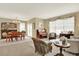 Spacious living area blending the living room and dining room, perfect for entertaining and Gathering gatherings at 16367 E Auburn Hills Dr, Parker, CO 80134