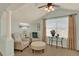 Cozy living room with plenty of natural light, comfortable seating, and neutral colors at 16367 E Auburn Hills Dr, Parker, CO 80134