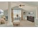 Comfortable living room with vaulted ceilings, ceiling fan and large windows at 16367 E Auburn Hills Dr, Parker, CO 80134
