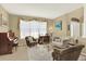 Inviting living room featuring ample seating, stylish furnishings, and a bright, airy atmosphere at 16367 E Auburn Hills Dr, Parker, CO 80134