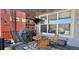 Inviting covered patio with dining set, decorative screens, and string lights, creating a cozy outdoor living space at 16367 E Auburn Hills Dr, Parker, CO 80134