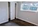 Bright bedroom featuring closet, and sunny windows at 5237 S Olive Rd, Evergreen, CO 80439