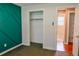 Bedroom featuring custom wall design and closet at 5237 S Olive Rd, Evergreen, CO 80439