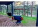 Relaxing porch swings beneath the deck create a cozy outdoor lounge area surrounded by scenic views at 5237 S Olive Rd, Evergreen, CO 80439