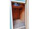 Interior view of a backyard storage shed with wood paneling and ample space at 5237 S Olive Rd, Evergreen, CO 80439