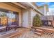 Back porch with outdoor seating, landscaping, and a sliding glass door at 2279 Coronado Pkwy # B, Denver, CO 80229