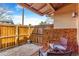 Fenced backyard with gravel, a wood fence, and outdoor seating at 2279 Coronado Pkwy # B, Denver, CO 80229