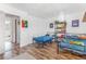 Bedroom with hardwood floors, white walls, and closet, and 2 metal beds at 2279 Coronado Pkwy # B, Denver, CO 80229