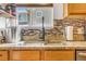 Modern kitchen sink with stone countertop and backsplash provides a functional, elegant workstation at 2279 Coronado Pkwy # B, Denver, CO 80229