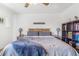Comfortable main bedroom featuring a stylish headboard and soft, neutral-toned bedding at 2279 Coronado Pkwy # B, Denver, CO 80229