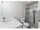 Bathroom features a modern sink and shower with glass door at 695 S Alton Way # 5A, Denver, CO 80247