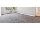 Cozy bedroom with a large window offering natural light and comfortable carpeting at 695 S Alton Way # 5A, Denver, CO 80247