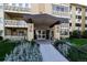 Close up of the building entrance with detailed brickwork and landscaping at 695 S Alton Way # 5A, Denver, CO 80247