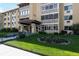 Exterior shot of a building with a beautiful green lawn and flower bed at 695 S Alton Way # 5A, Denver, CO 80247