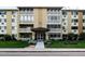 Exterior shot showing the building with well-maintained landscaping at 695 S Alton Way # 5A, Denver, CO 80247