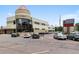 Commercial building exterior with ample parking and signage for a restaurant and golf course at 695 S Alton Way # 5A, Denver, CO 80247