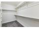 Walk-in closet with carpeted floor, wire shelving, and a hanging rod at 695 S Alton Way # 5A, Denver, CO 80247