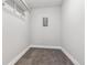 A small walk-in closet provides efficient storage with a rod for hanging garments at 695 S Alton Way # 5A, Denver, CO 80247