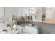 Open concept living area with modern furnishings and a view into the updated kitchen at 695 S Alton Way # 5A, Denver, CO 80247