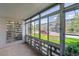 Relax on the screened-in patio with views of the building and front garden at 695 S Alton Way # 5A, Denver, CO 80247