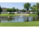 A view of the well-manicured golf course, sand trap and pond with fountain at 695 S Alton Way # 5A, Denver, CO 80247
