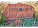 An Emerald Greens Golf Club sign made of rock is surrounded by greenery at 695 S Alton Way # 5A, Denver, CO 80247