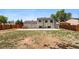 Spacious backyard with a patio, ideal for outdoor activities and relaxation at 5202 Dillon St, Denver, CO 80239