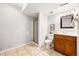 Bathroom with a shower stall, sink, and toilet at 5202 Dillon St, Denver, CO 80239