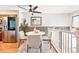 Open dining area featuring modern decor, brick accent wall, and neutral tones at 5202 Dillon St, Denver, CO 80239