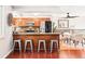 Well-appointed kitchen with stainless steel appliances, granite countertops, and breakfast bar seating at 5202 Dillon St, Denver, CO 80239
