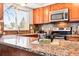 Stylish kitchen with granite countertops and stainless-steel microwave and oven at 5202 Dillon St, Denver, CO 80239