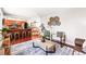 Open-concept living area with hardwood floors flowing into dining room and kitchen, perfect for entertaining at 5202 Dillon St, Denver, CO 80239