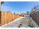 Long backyard with detached garage and wooden fence at 1846 S Lowell Blvd, Denver, CO 80219