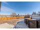 Large backyard with wooden fence and detached garage at 1846 S Lowell Blvd, Denver, CO 80219