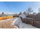 Spacious backyard with detached garage and wooden fence at 1846 S Lowell Blvd, Denver, CO 80219