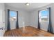 Spacious bedroom with hardwood floors and large windows at 1846 S Lowell Blvd, Denver, CO 80219