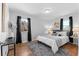 Main bedroom with hardwood floors and ample natural light at 1846 S Lowell Blvd, Denver, CO 80219