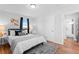 Bright bedroom with hardwood floors and a view of the backyard at 1846 S Lowell Blvd, Denver, CO 80219