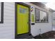 Eye-catching bright green front door with gray trim at 1846 S Lowell Blvd, Denver, CO 80219