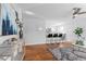 Open living room with hardwood floors and kitchen island at 1846 S Lowell Blvd, Denver, CO 80219