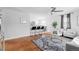 Open living space with hardwood floors, a kitchen and seating area at 1846 S Lowell Blvd, Denver, CO 80219