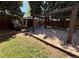 Large backyard with stone patio, partial pergola, and plenty of space for outdoor activities at 2213 S Meade Street, Denver, CO 80219