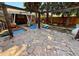 Backyard stone patio with outdoor seating at 2213 S Meade Street, Denver, CO 80219