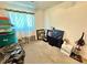 Bedroom with carpet filled with storage bins and suitcases at 2213 S Meade Street, Denver, CO 80219