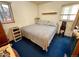 Bedroom with a large bed, window, and night stand at 2213 S Meade Street, Denver, CO 80219