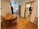 Charming dining area with a wooden table and chairs, flowing into other rooms at 2213 S Meade Street, Denver, CO 80219