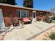 Comfortable seating on the front porch, perfect for enjoying the outdoors at 2213 S Meade Street, Denver, CO 80219